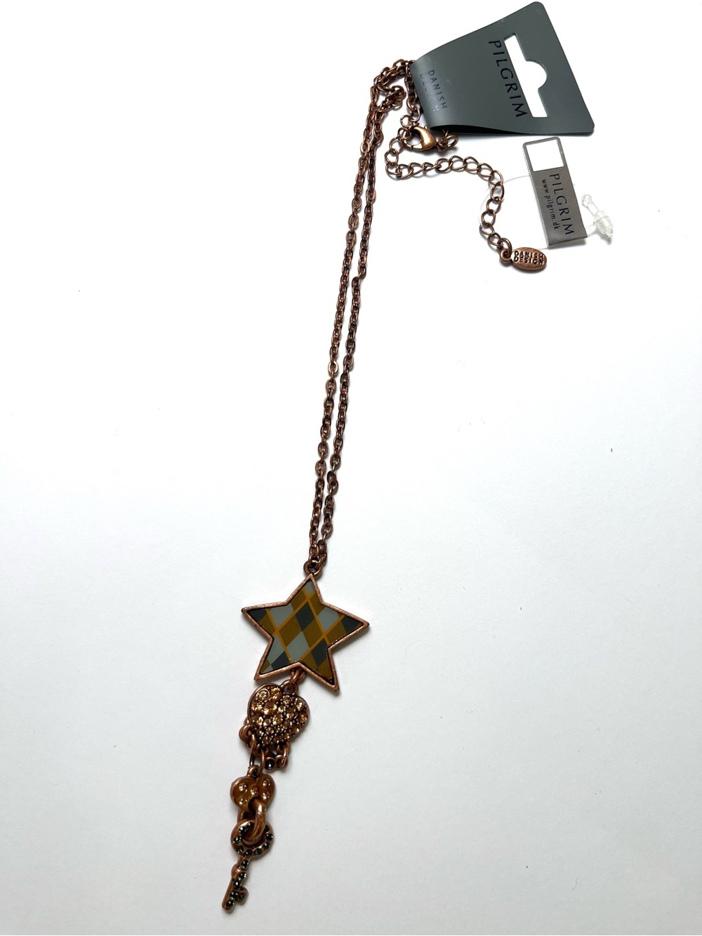 Copper tone necklace with charms